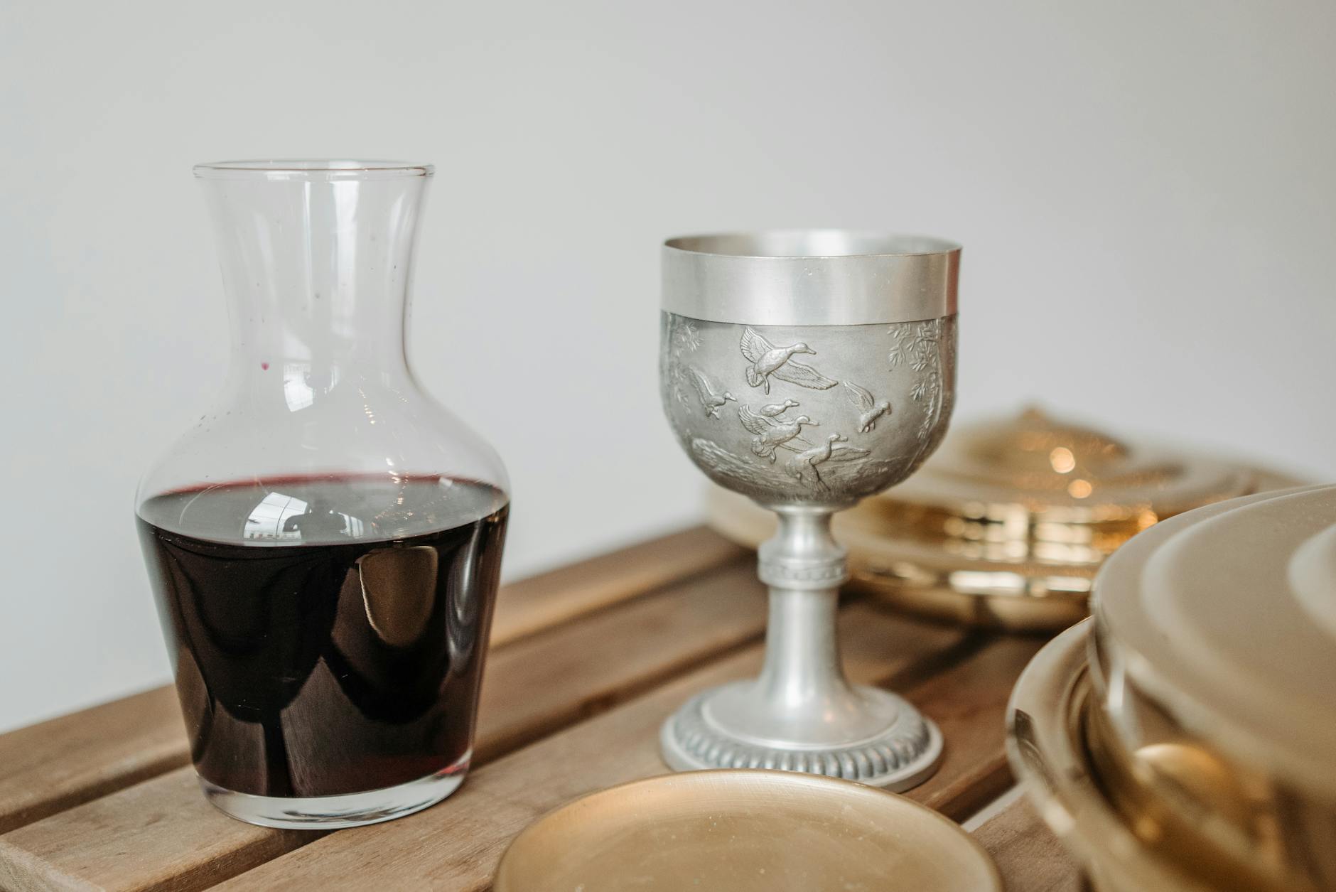 red wine on a decanter and a pewter goblet